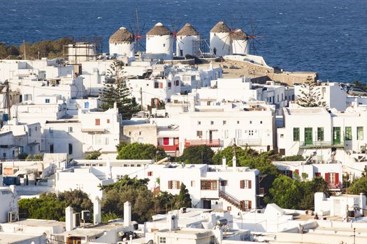 panoramic view of the Mykonos town harbor from the above hills on a sunny summer day, Mykonos, Cyclades, Greece