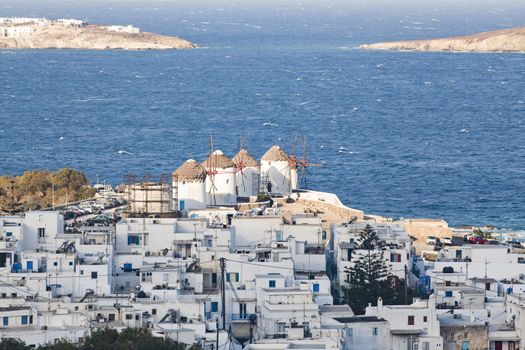panoramic view of the Mykonos town harbor from the above hills on a sunny summer day, Mykonos, Cyclades, Greece