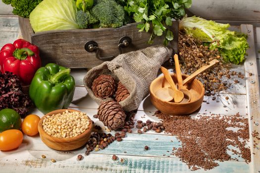 Pepper, cedar beans and vegetables on a wooden desk