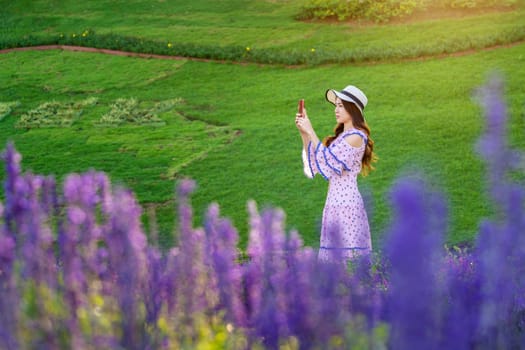 Beautiful woman on a flower garden.