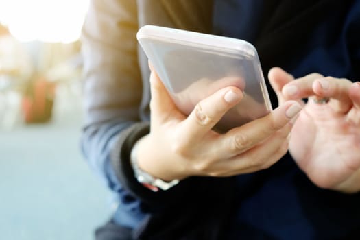 Phone on hands.