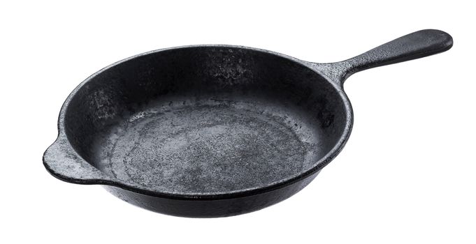 Old cast iron pan isolated on white background with clipping path, vintage empty skillet
