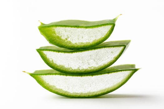 Pieces of aloe vera leaf on a white background