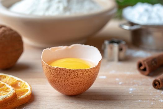 Fresh egg and other ingredients for Christmas baking