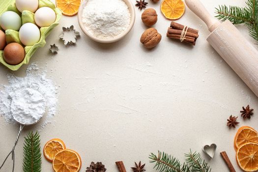 Ingredients for Christmas baking on a beige background with copy space