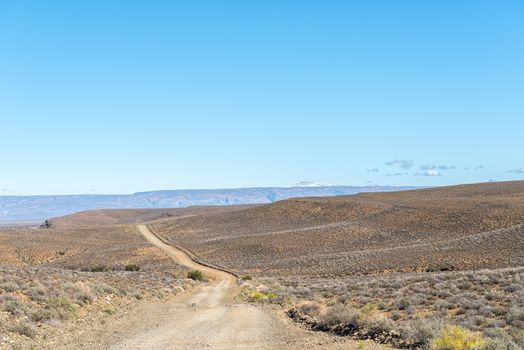 A landscape on road R356 to Ceres in the Western Cape Province. Snow is visible on Sneeuberg in the Cederberg, to the right