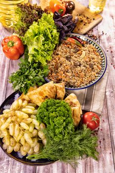 Traditional Asian food on an old wooden desk with different ingredients