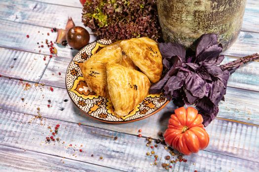 Traditional Asian food Samsa on an old wooden desk