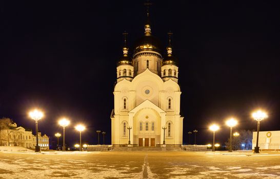 The Cathedral is illuminated by lamps at night.