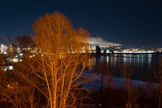 Evening view of the city of Khabarovsk in the winter. The ice on the Amur river.