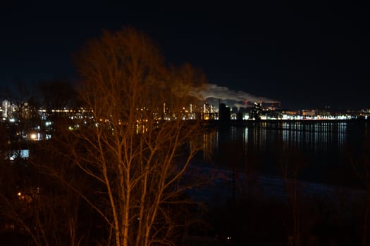 Evening view of the city of Khabarovsk in the winter. The ice on the Amur river.