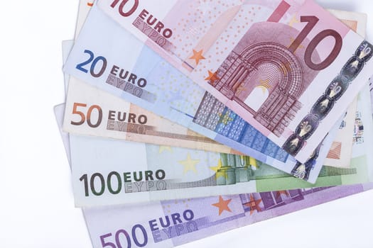 Different euro banknotes closeup on white background