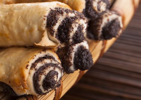 Croissant filled with chocolate closeup on wood background