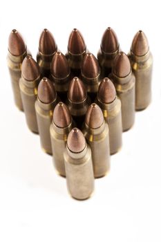 Rifle bullets close-up isolated on white background