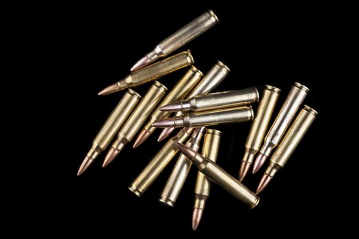 Rifle bullets close-up on black background