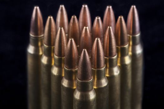 Rifle bullets close-up on black background