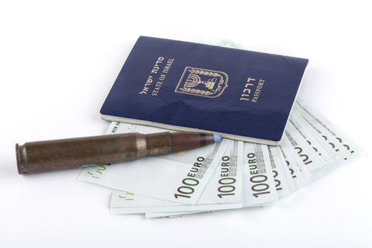 Israelian passport with 100 euro banknotes and a rifle bullet isolated on white background