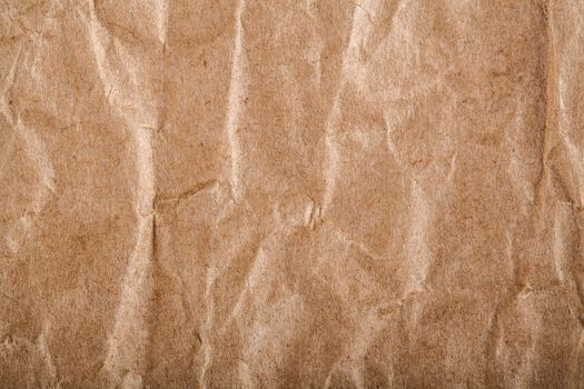 Old brown wrapping wrinkled paper closeup texture