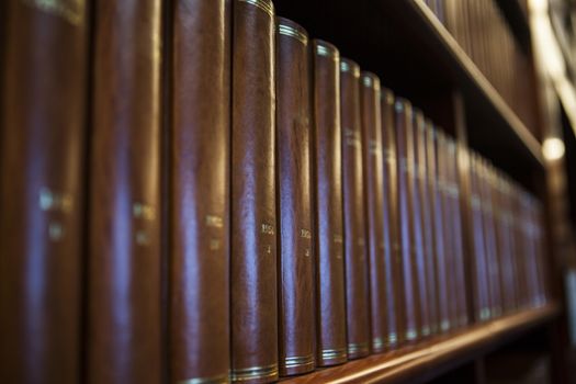 Book shelf in a church library full with brown books
