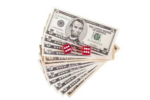 Pair of red dice showing 6 on dollar banknotes isolated on white