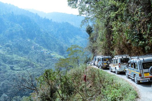 Pelling, Sikkim, India May 16 2018: Tourist vehicles lined up to climb in the step hill region of himalayan mountain valley.