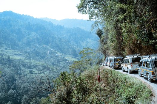 Pelling, Sikkim, India May 16 2018: Tourist vehicles lined up to climb in the step hill region of himalayan mountain valley.