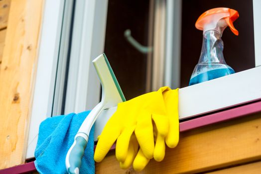 on the window sill close-up are tools for cleaning the glass window