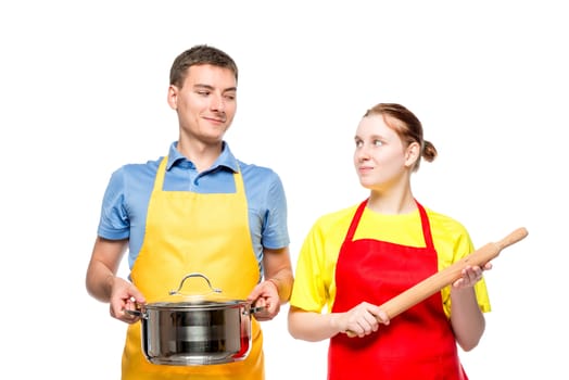 horizontal portrait of a man with a pan and a woman with a rolling pin on a white background