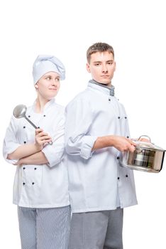 cooks in suits with a pan and a ladle posing on a white background