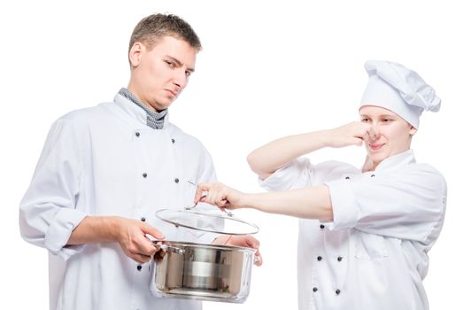 concept photo - cooks and foul soup in a pan, shooting on a white background