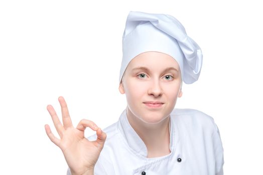 portrait of a young experienced chef with hand gesture on white background isolated