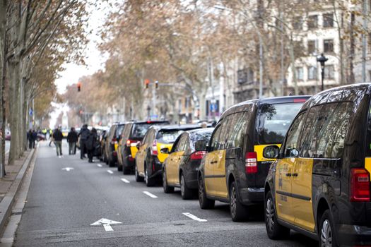 Taxi drivers strike in Barcelona. The main street of the city, blocked by taxi cars.