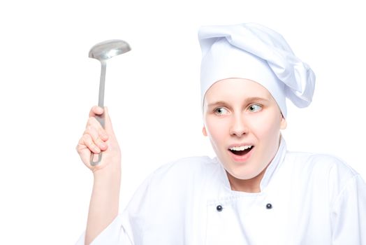 portrait of an emotional chef in cap with a ladle on white background isolated