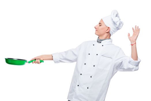 professional chef with a frying pan on a white background in the studio, portrait isolated