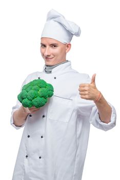 culinary master with broccoli on white background posing