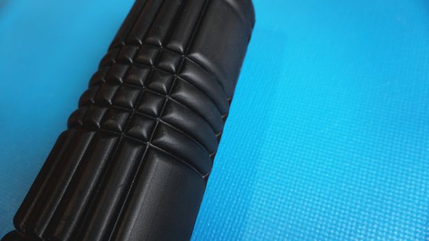 Foam Roller Gym Fitness Equipment Blue background self Myofascial Release - MFR.