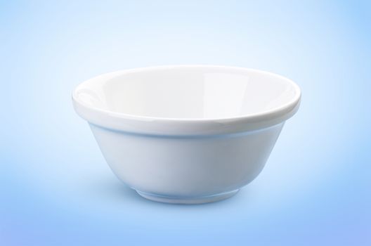 Empty white bowl isolated on a blue background, ideal for the presentation of dairy products
