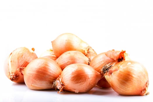 Fresh onion bulbs isolated on white background