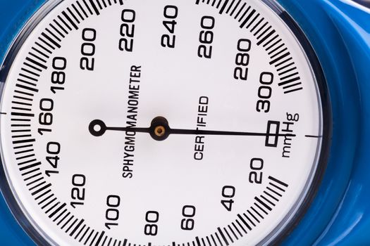 Blue Sphygmomanometer close-up isolated on white background