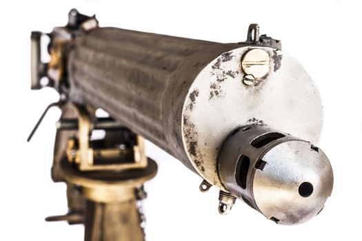 old Silver and gold color machine gun front closeup isolated on white background