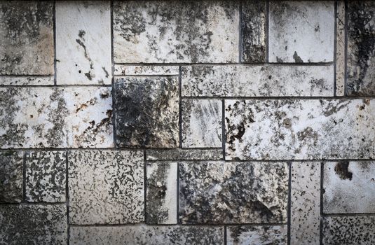 Aged Rectangular stone wall texture closeup