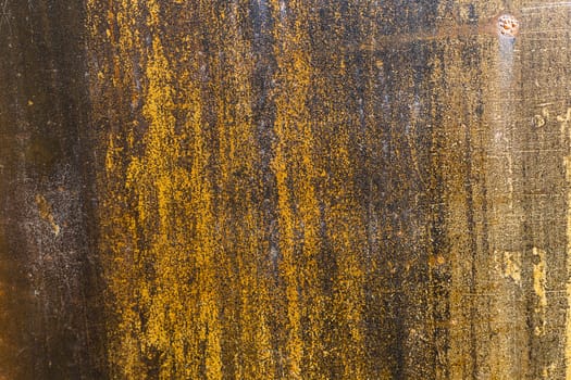 Old rusty texture on a metal plate abstract closeup