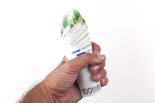 Man hand holding a roll of hundred euro banknotes isolated on white background