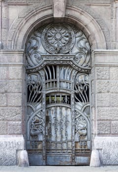 old blue iron entrance door with carving and iron textures