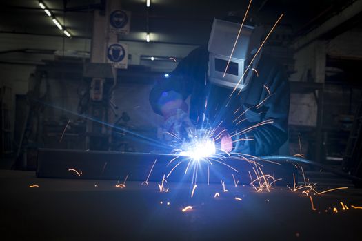 Welder working in a steel construction fatory