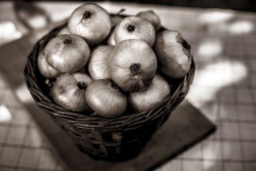 Onion in a basket old stylich photot