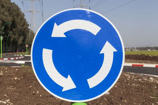 Roundabout blue traffic sign with background