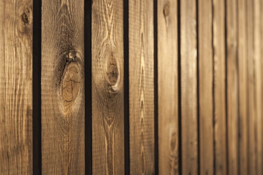 Old wood brown fence  closeup with interesting texture