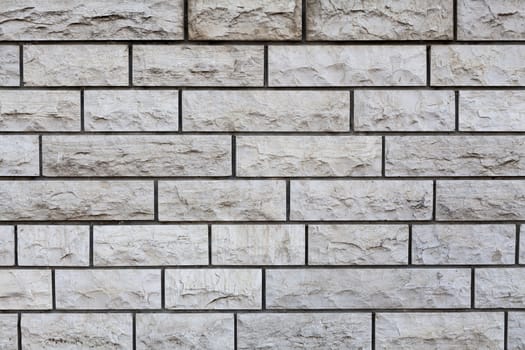 Aged brown Rectangular stone wall texture closeup