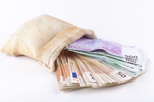 A bag full with euro banknotes isolated on white background